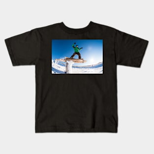 Snowboarder sliding on a rail Kids T-Shirt